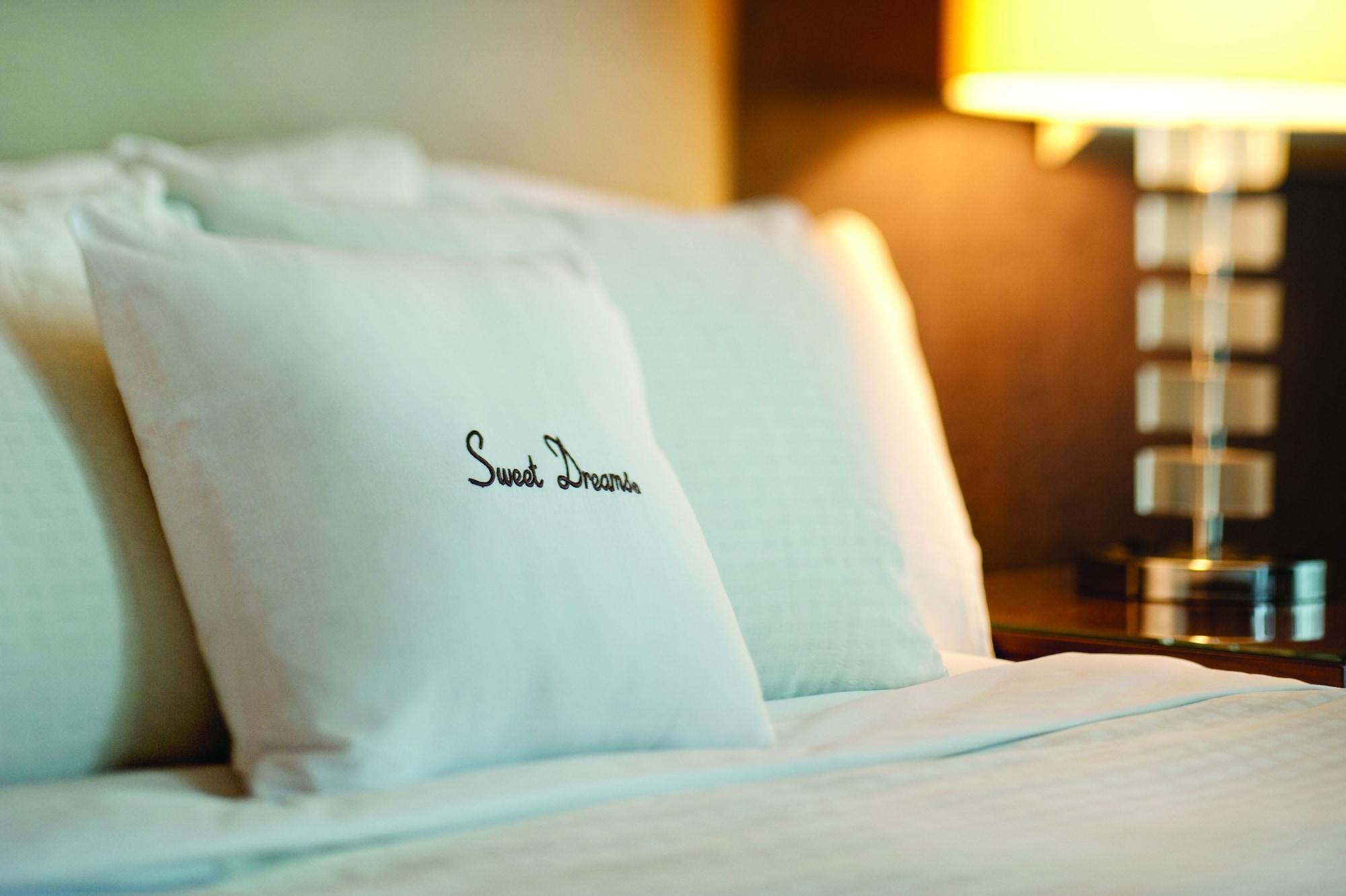 Doubletree By Hilton Kuala Lumpur Hotel Exterior photo A pillow with the "Sweet Dreams" logo